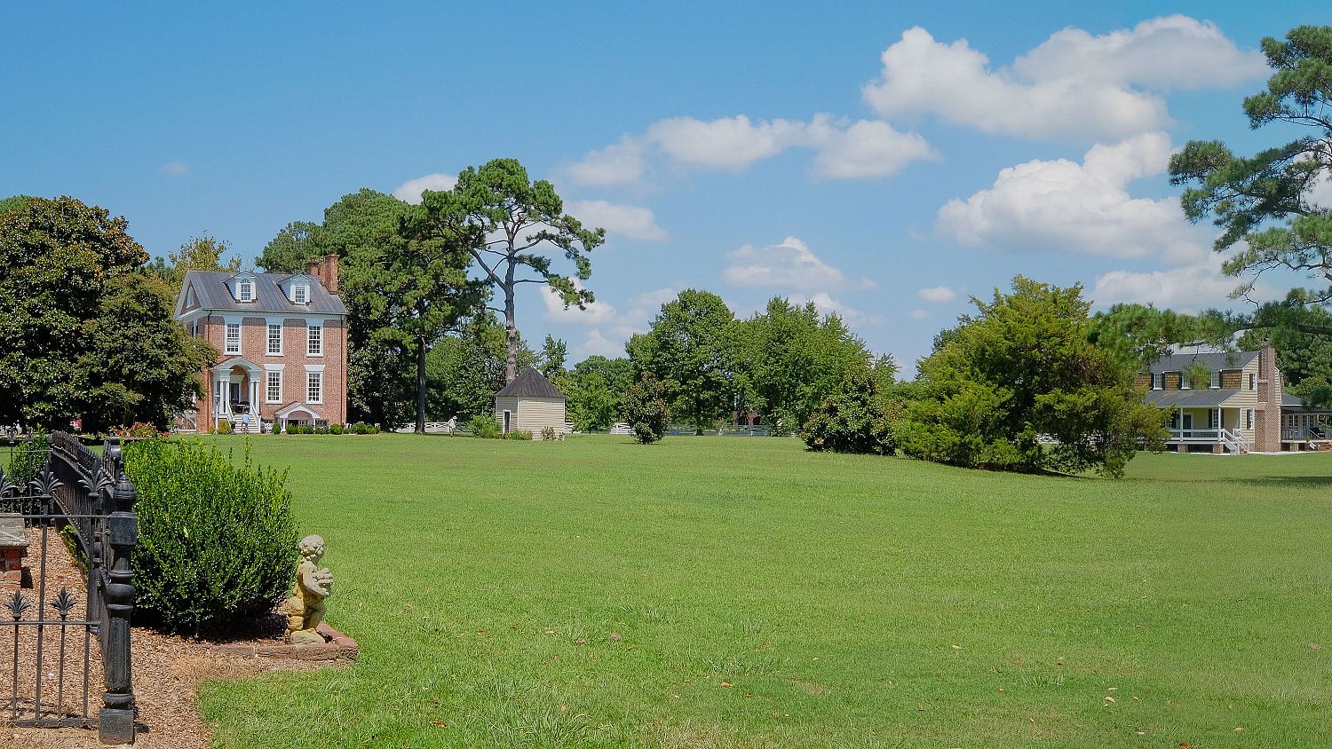 The open greensward of the Mulberry Hill manor house seen from the shore of the Albemarle Sound